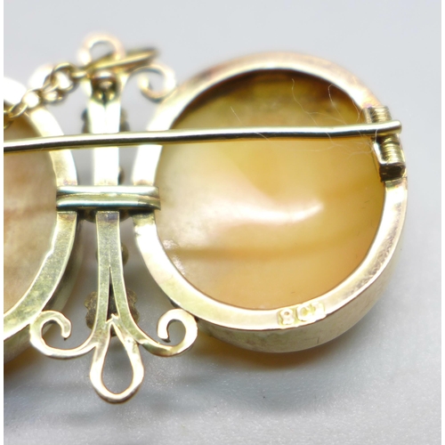 1085 - A 9ct gold double cameo brooch, 7.6g