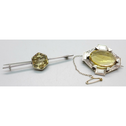 1089 - Two white metal set citrine brooches, largest stone a/f