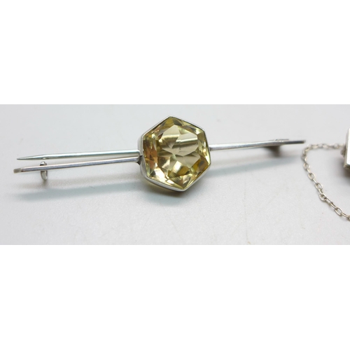 1089 - Two white metal set citrine brooches, largest stone a/f