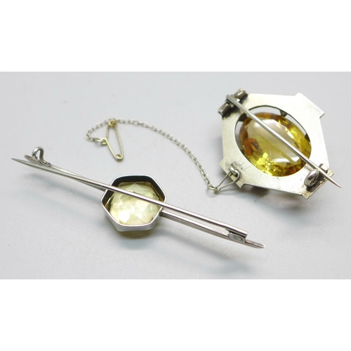 1089 - Two white metal set citrine brooches, largest stone a/f