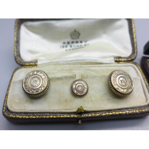 Two sets of studs, one set in an Asprey box and a pair of cufflinks