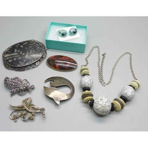 1099 - A collection of silver and white metal jewellery, (two brooches marked, all test as silver, large br... 