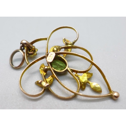 1102 - A 9ct gold and peridot pendant, 2g