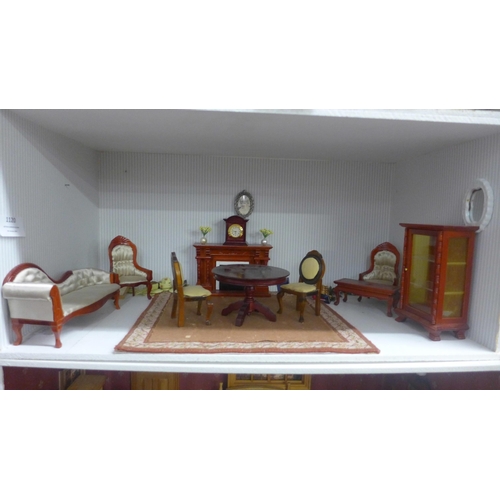 1120 - A six stacking doll's house display cabinet with dolls and dolls house furniture **PLEASE NOTE THIS ... 