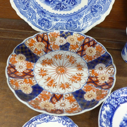 680 - An oriental charger and plate, blue and white china and a cranberry glass custard cup **PLEASE NOTE ... 