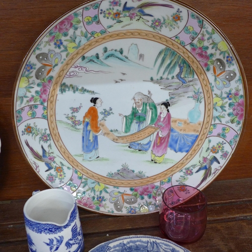 680 - An oriental charger and plate, blue and white china and a cranberry glass custard cup **PLEASE NOTE ... 