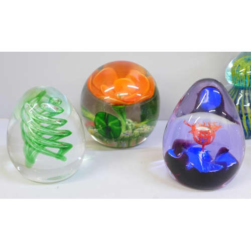 692 - Two M'dina glass paperweights, a Caithness glass paperweight and three others