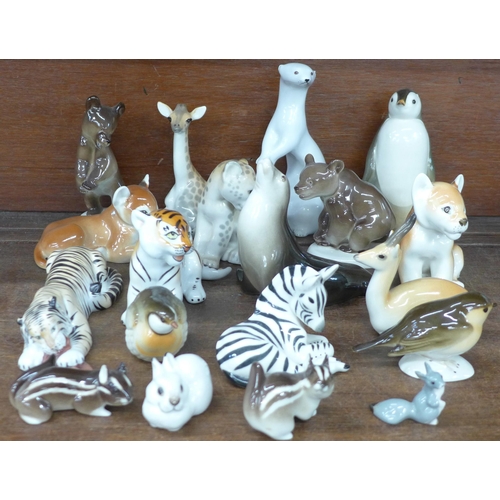 693 - A collection of USSR Lomonosov ceramic models of animals; tiger, lion cubs, giraffes, zebra, bears, ... 