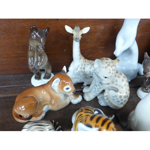 693 - A collection of USSR Lomonosov ceramic models of animals; tiger, lion cubs, giraffes, zebra, bears, ... 