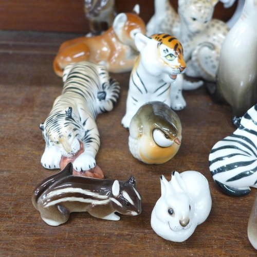 693 - A collection of USSR Lomonosov ceramic models of animals; tiger, lion cubs, giraffes, zebra, bears, ... 