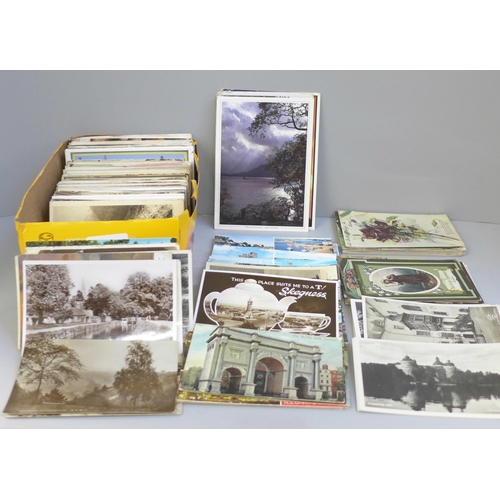 696 - A box of postcards, vintage to modern