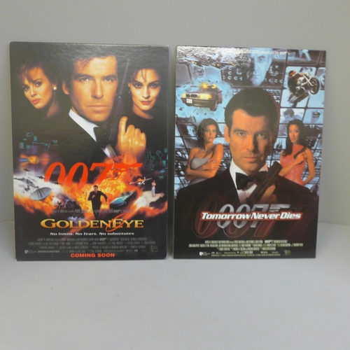 715 - A James Bond selection including lobby cards, stickers, cards, promotional material, etc.