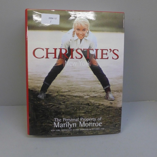 734 - A Christies of New York Marilyn Monroe auction book, 1999