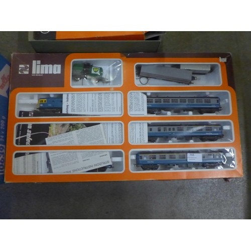 755 - A Lima HO scale train set, track, buildings and accessories