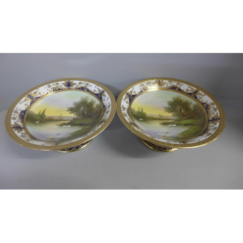 756 - A pair of Noritake hand painted comport/sweetmeat dishes, small chip on the rim of one