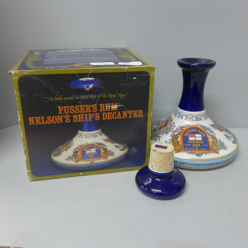 780 - A bottle of Pusser's Rum in a Wade Nelson's ship's decanter, boxed with stopper