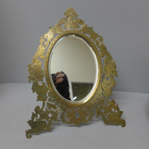 783 - A circa 1900 mirror with brass frame and bevelled mirror, 30cm