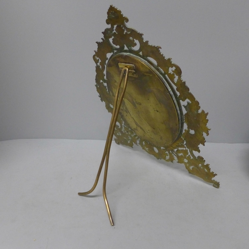 783 - A circa 1900 mirror with brass frame and bevelled mirror, 30cm