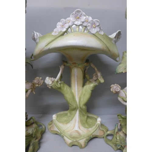 788 - A pair of tall German Art Nouveau figural vases and a tall figural pedestal dish, a/f (damage to fin... 