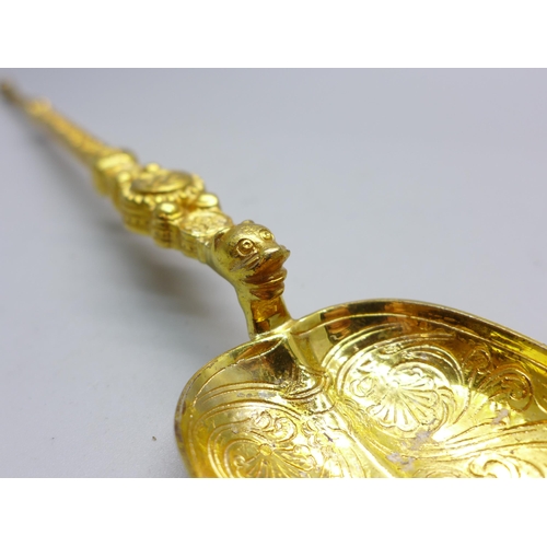 802 - A silver gilt anointing spoon, London 1901, Saunders & Shepherd, 102g, 25.5cm