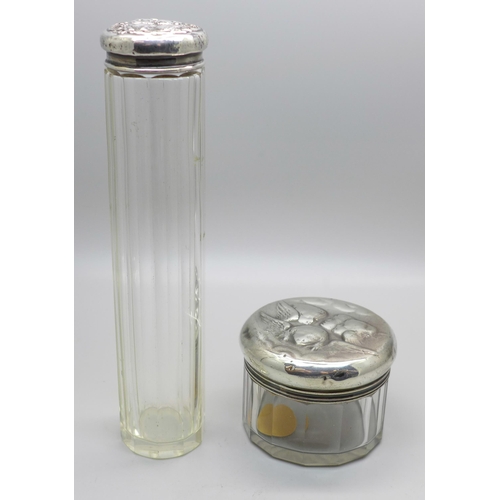 805 - A silver topped glass jar by William Comyns and a silver topped bottle, both with Reynolds Angels de... 