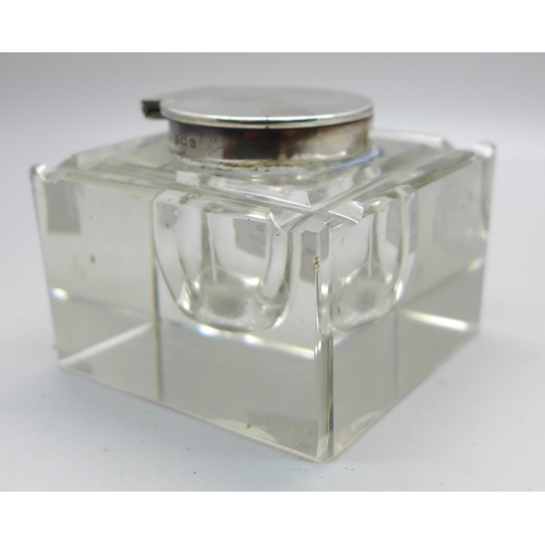 812 - A silver topped cut glass inkwell, Birmingham 1931