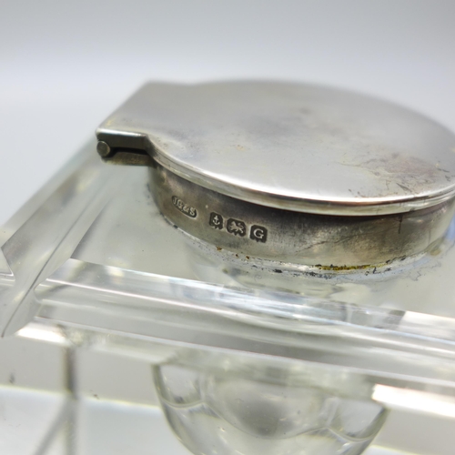 812 - A silver topped cut glass inkwell, Birmingham 1931