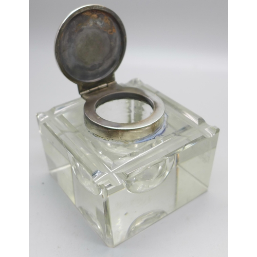 812 - A silver topped cut glass inkwell, Birmingham 1931