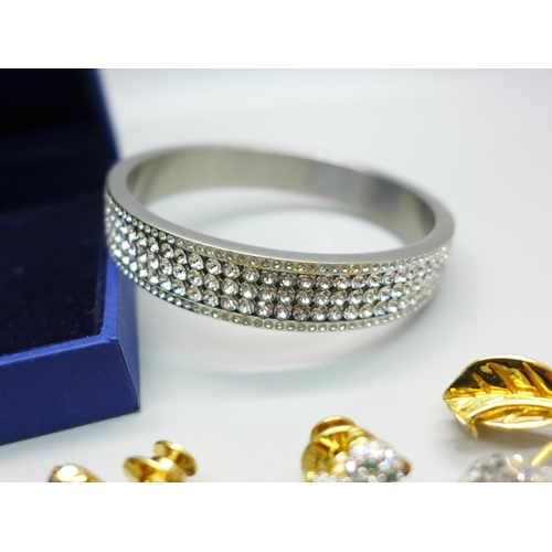 826 - A Swarovski bangle, boxed, and assorted Swarovski jewellery