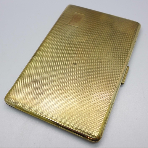 833 - A gold plated cigarette case, marked made in England, 82mm x 127mm