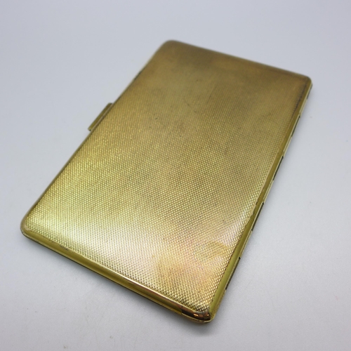 833 - A gold plated cigarette case, marked made in England, 82mm x 127mm