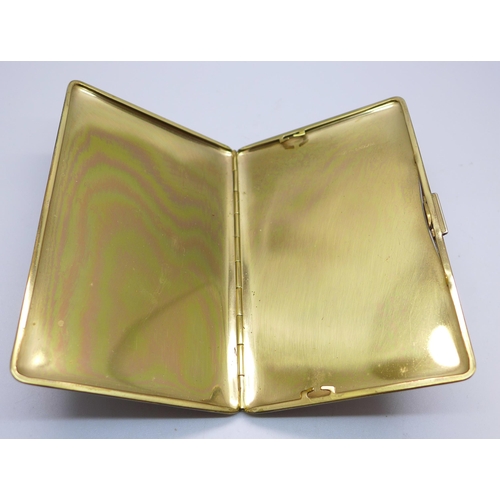 833 - A gold plated cigarette case, marked made in England, 82mm x 127mm