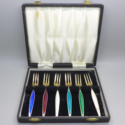 834 - A cased set of six Danish silver and coloured enamel forks, enamel on one white fork a/f