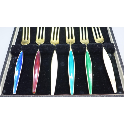 834 - A cased set of six Danish silver and coloured enamel forks, enamel on one white fork a/f