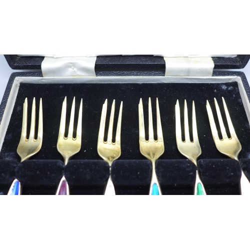 834 - A cased set of six Danish silver and coloured enamel forks, enamel on one white fork a/f