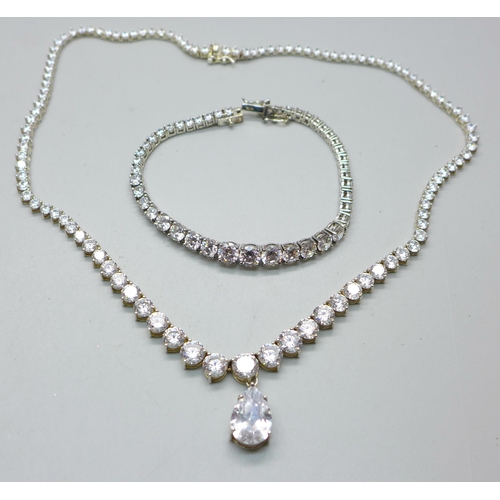 842 - A silver and white stone necklace and matching bracelet