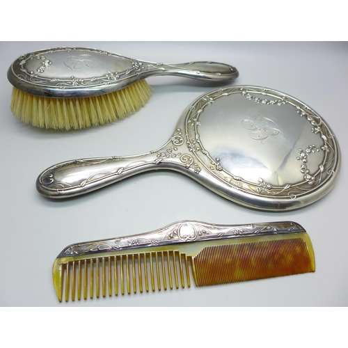 854 - A three piece silver dressing table set by William Comyns, London 1908/09, in original retail box