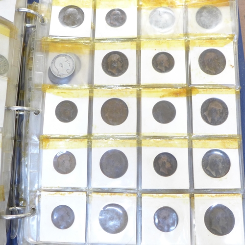 876 - An album of coins, ten pages of GB, 1910 onwards and five pages of foreign coins and some medallions... 