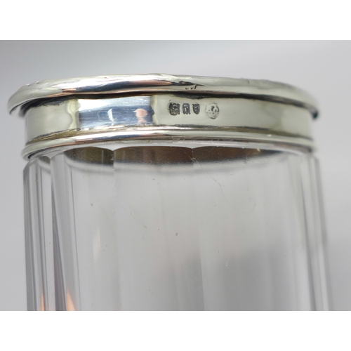 879 - Two silver and tortoiseshell topped glass jars