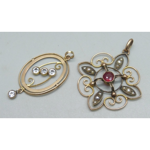 902 - A 9ct gold pendant set with a garnet and seed pearls, 3.8cm drop, and a 9ct gold pendant set with fo... 