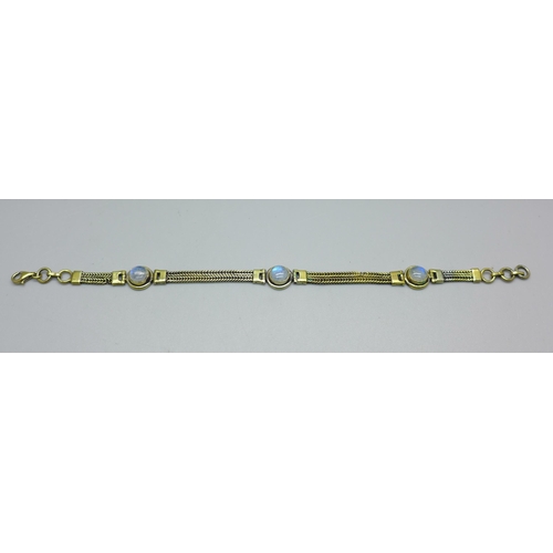 905 - A silver gilt and blue moonstone bracelet