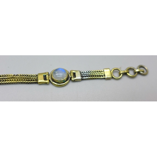 905 - A silver gilt and blue moonstone bracelet