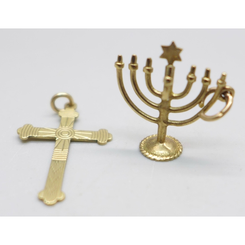 944 - A 9ct gold Jewish Menorah charm and a 9ct gold cross pendant, 2.4g