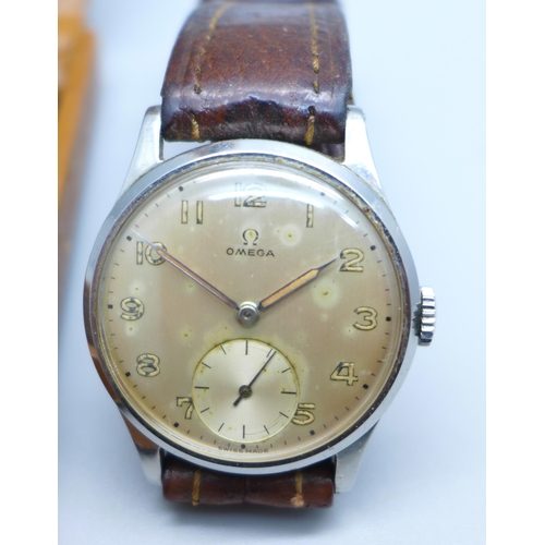 946 - A stainless steel Omega wristwatch with subsidiary second hand dial, cased