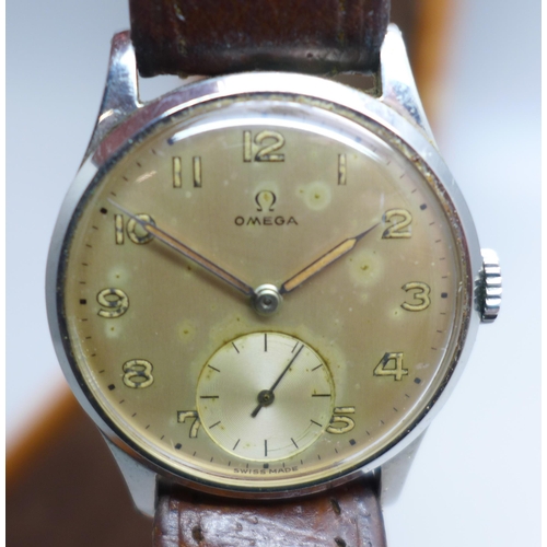 946 - A stainless steel Omega wristwatch with subsidiary second hand dial, cased