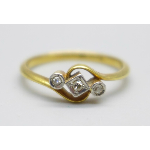 947 - An 18ct gold three stone diamond ring, 2.2g, N