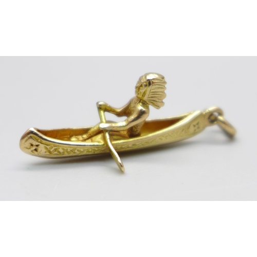 949 - A hallmarked 9ct gold canoe charm with Native American, 2.4g