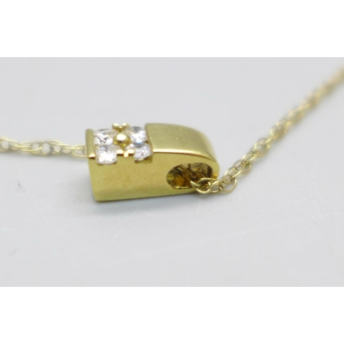 957 - An 18ct gold and diamond pendant on a 9ct gold chain, 1.6g