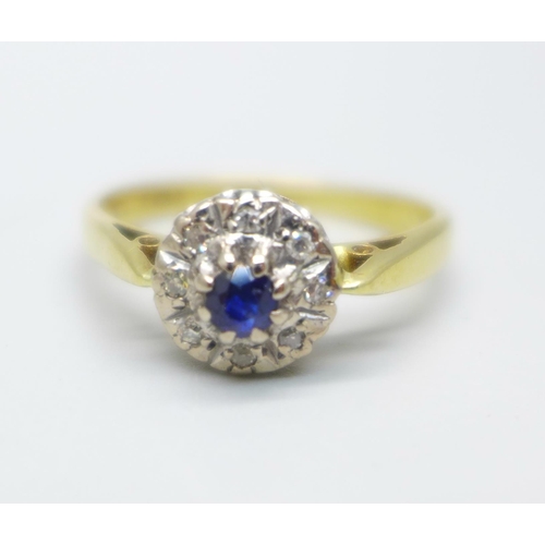 964 - An 18ct gold, sapphire and diamond cluster ring, 3.9g, R