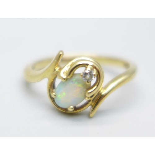 966 - A 14k gold, opal and diamond ring, 2.4g, L